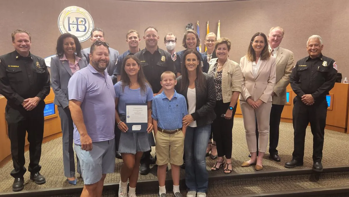 Elizabeth Felten (front, 2nd L) was honored at the Huntington Beach City Council meeting in Huntington Beach on Aug. 2, 2022. (Courtesy of the City of Huntington Beach)