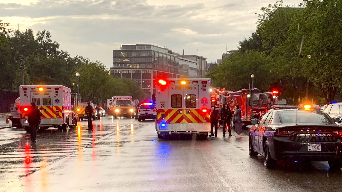 Emergency medical crews are staged on Pennsylvania Avenue between the White House and Lafayette Park in Washington on the evening of Aug. 4, 2022. (D.C. Fire and EMS/Twitter via AP)