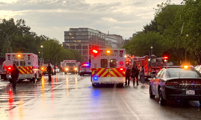 Emergency medical crews are staged on Pennsylvania Avenue between the White House and Lafayette Park in Washington on the evening of Aug. 4, 2022. (DC Fire and EMS/Twitter via AP)