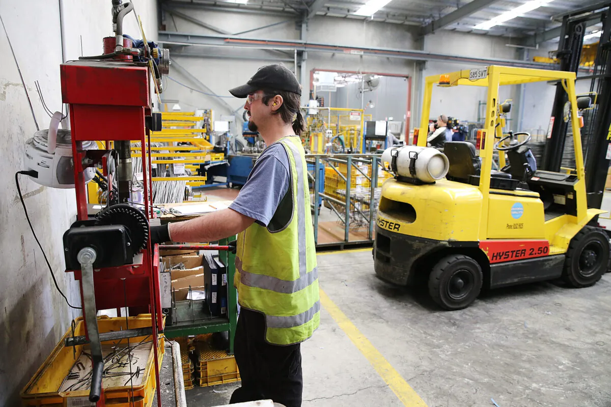An employee works at the Multi Slide Industries manufacturing plant in Adelaide, Australia, on Aug. 12, 2013. (Morne de Klerk/Getty Images)