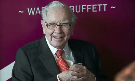 Warren Buffett’s Firm Reports $12.8 Billion Loss as Investments Fall but Its Insurers Performed Well