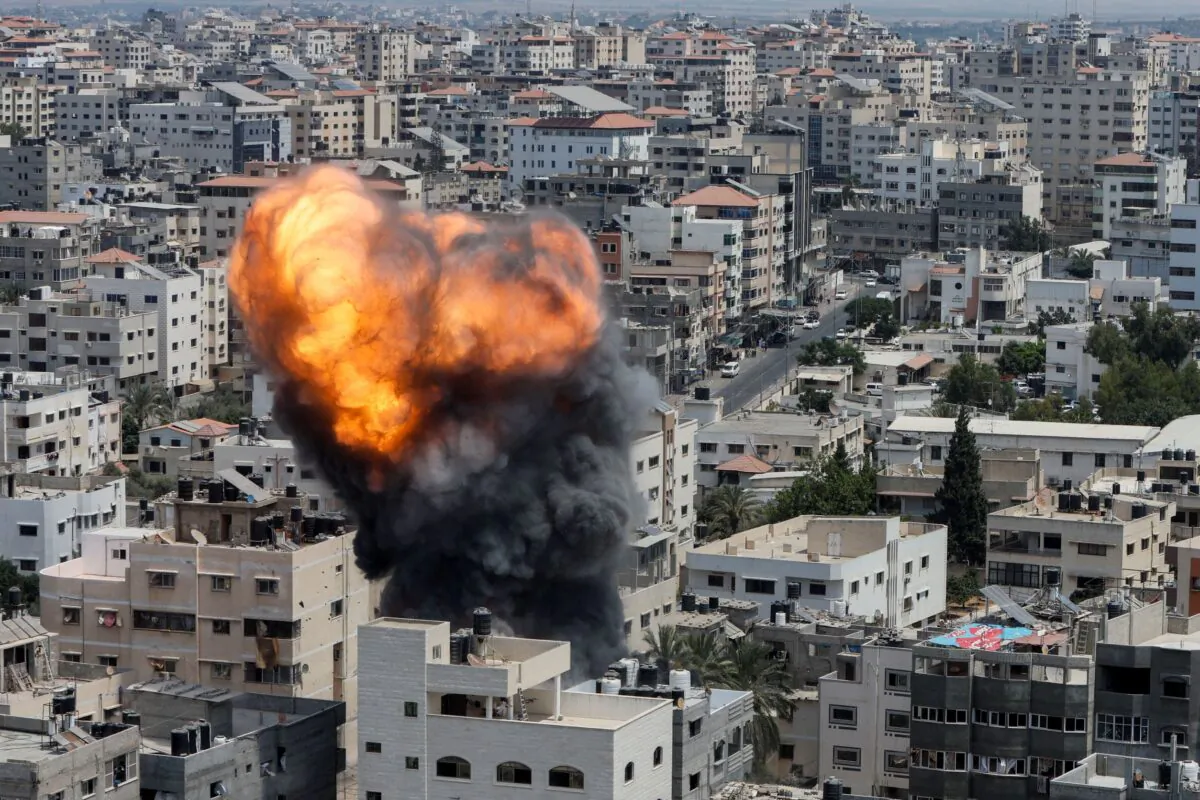 Flame and smoke rise during an Israeli air strike in Gaza City on Aug. 6, 2022. (Mohammed Salem/Reuters)
