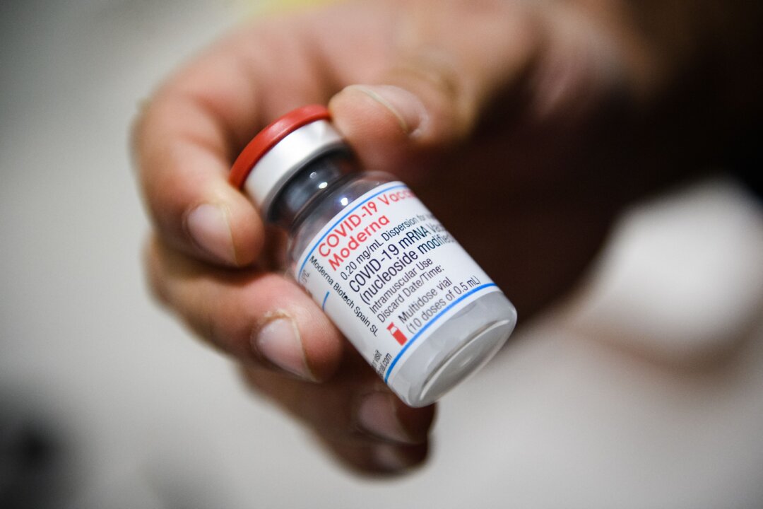 A nurse holds a vial of Moderna COVID-19 vaccine in Septeme-Les-Vallons, France on Jan. 12, 2022. (Clement Mahoudeau/AFP via Getty Images)