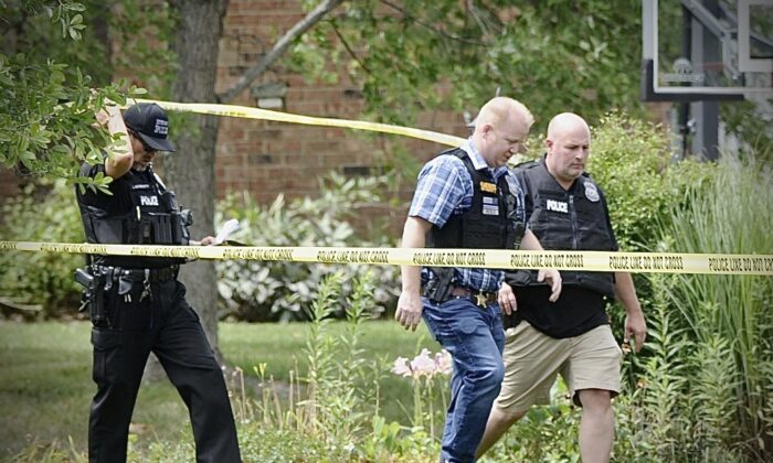 Police investigate a shooting in Butler Township, Ohio on Aug. 5, 2022. (Marshall Gorby/Dayton Daily News via AP)