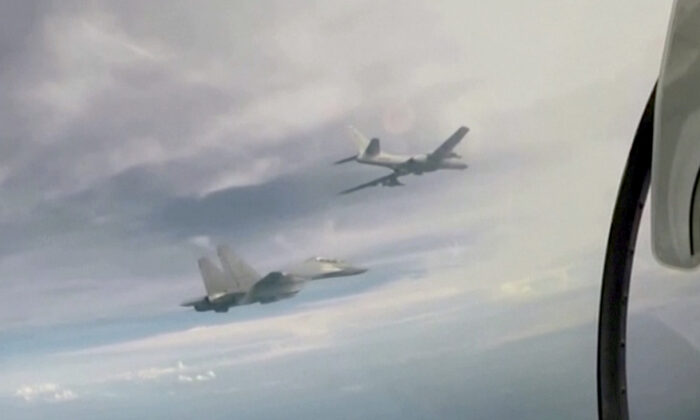 Chinese fighter jets fly in the sky near Taiwan in a still from a video released by Chinese state-run media CCTV on Aug. 7, 2022. (CCTV via Reuters/Screenshot via The Epoch Times)
