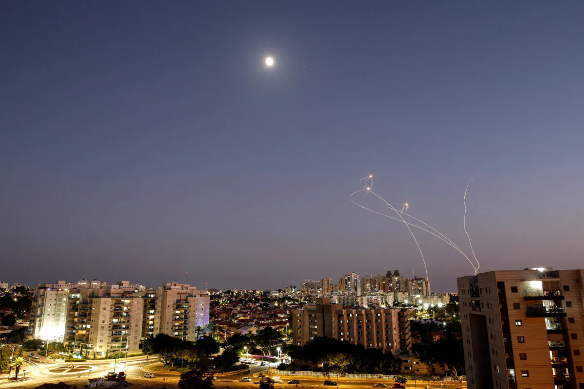 Streaks of light are seen as Israel's Iron Dome anti-missile system intercept rockets launched from the Gaza Strip towards Israel, as seen from Ashkelon, Israel, on Aug. 7, 2022. (Amir Cohen/Reuters)