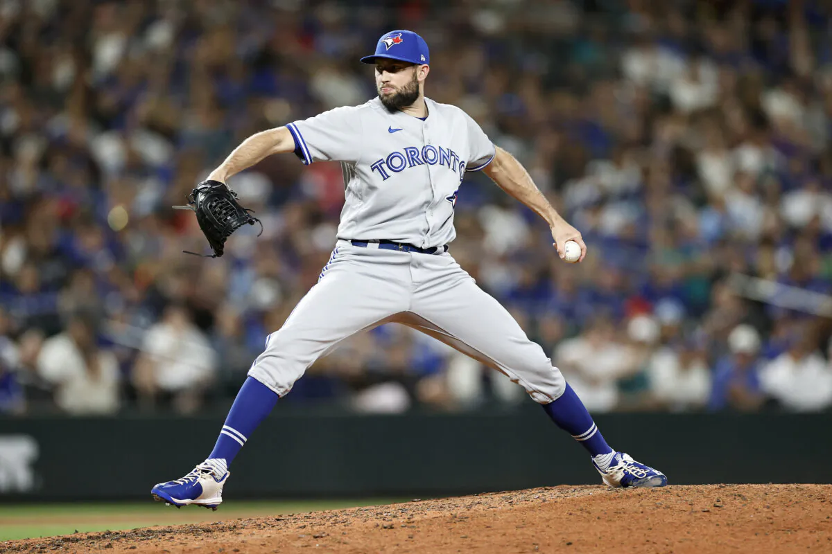 Tim Mayza (58) of the Toronto Blue Jays pitches during the eighth inning against the Seattle Mariners at T-Mobile Park in Seattle on July 8, 2022. (Steph Chambers/Getty Images)