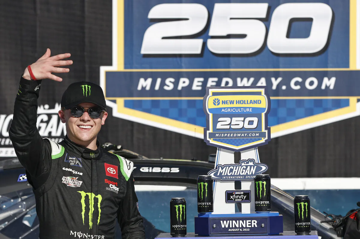 Ty Gibbs, driver of the #54 Monster Energy Toyota, celebrates in victory lane after winning the NASCAR Xfinity Series New Holland 250 at Michigan International Speedway in Brooklyn, Mich., on Aug. 6, 2022. (Sean Gardner/Getty Images)