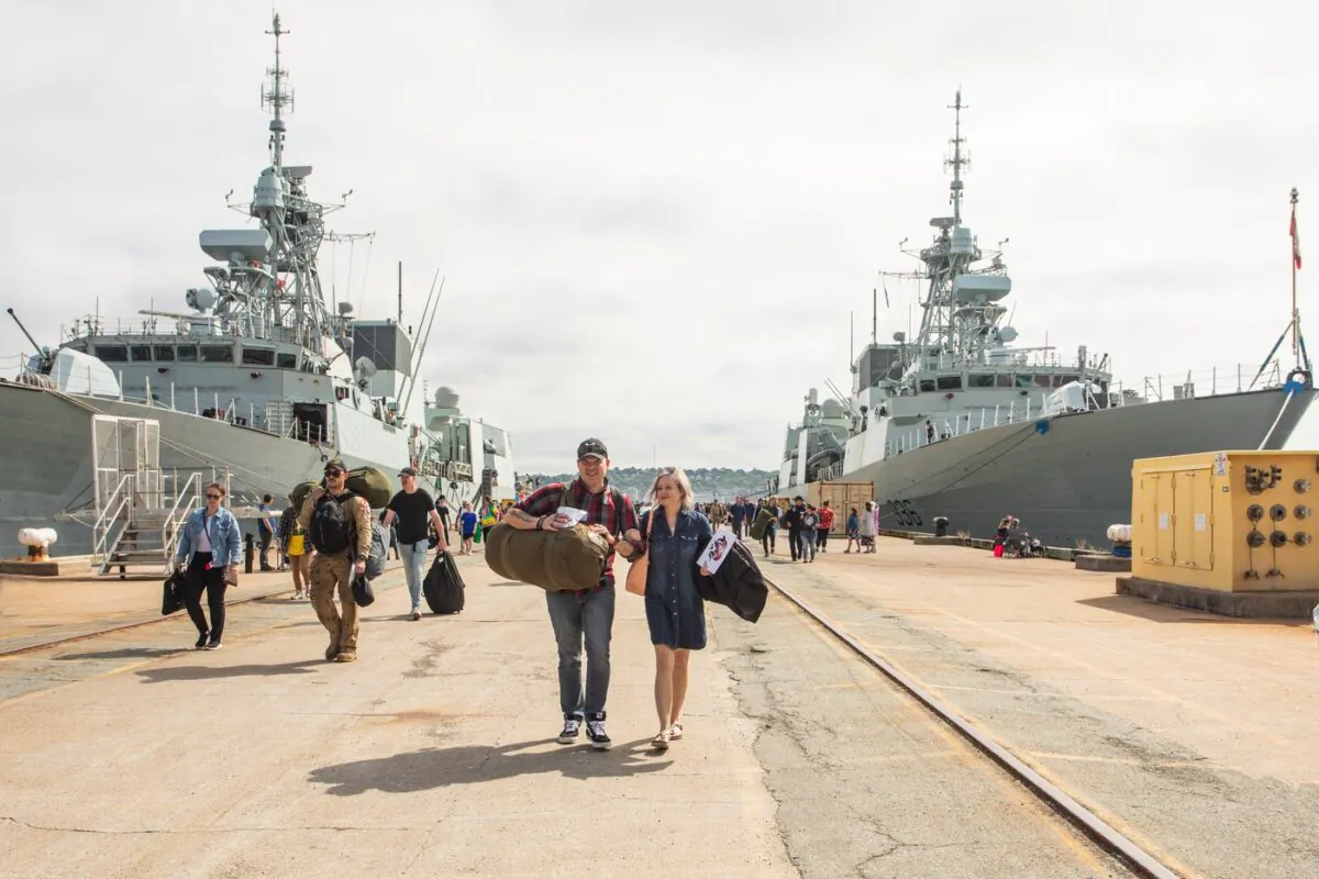 Returning sailors and their family and friends are seen as the HMC Ships Halifax and Montreal return from deployment to NATO's Operation Reassurance at the HMC Dockyard in Halifax on July 15, 2022. (The Canadian Press/Kelly Clark)