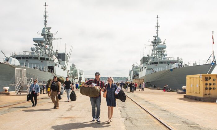 Returning sailors and their family and friends are seen as the HMC Ships Halifax and Montreal return from deployment to NATO's Operation Reassurance at the HMC Dockyard in Halifax on July 15, 2022. (The Canadian Press/Kelly Clark)