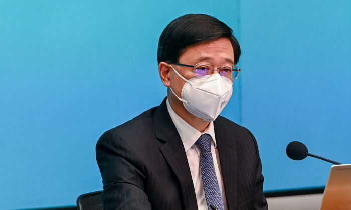 CE John Lee chairs a press conference on anti-epidemic measures on Aug. 8, 2022. (Sung Pi-lung/The Epoch Times)