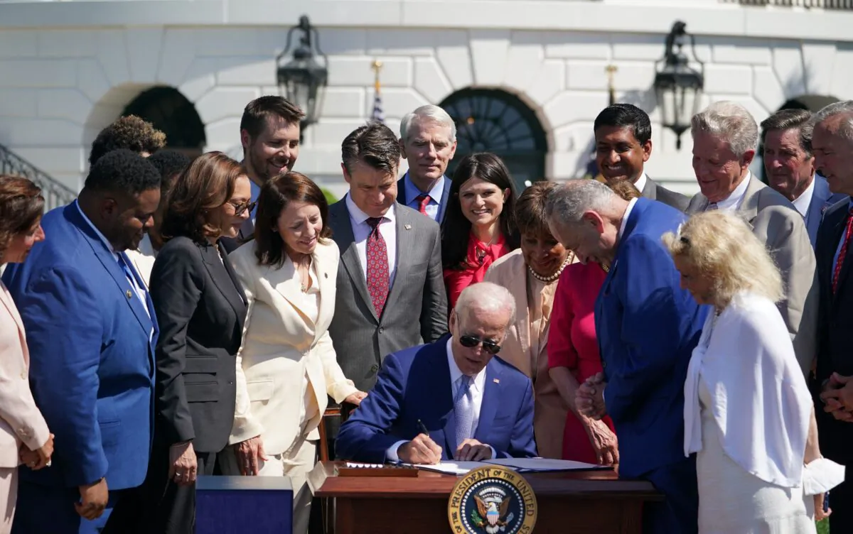 President Joe Biden (C) signs H.R. 4346, the CHIPS and Science Act of 2022, on the South Lawn of the White House on Aug. 9, 2022. (Mandel Ngan/AFP via Getty Images)