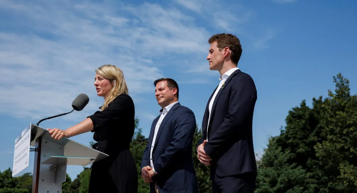 Minister of Foreign Affairs Melanie Joly speaks alongside the minister of Public Safety Marco Mendicino and Liberal MP Yvan Baker, during a press conference announcing new gun control laws, in Toronto on Aug. 5, 2022. (The Canadian Press/Cole Burston)