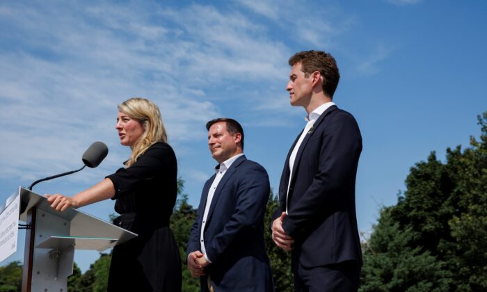 Minister of Foreign Affairs Melanie Joly speaks alongside the minister of Public Safety Marco Mendicino and Liberal MP Yvan Baker, during a press conference announcing new gun control laws, in Toronto on Aug. 5, 2022. (The Canadian Press/Cole Burston)