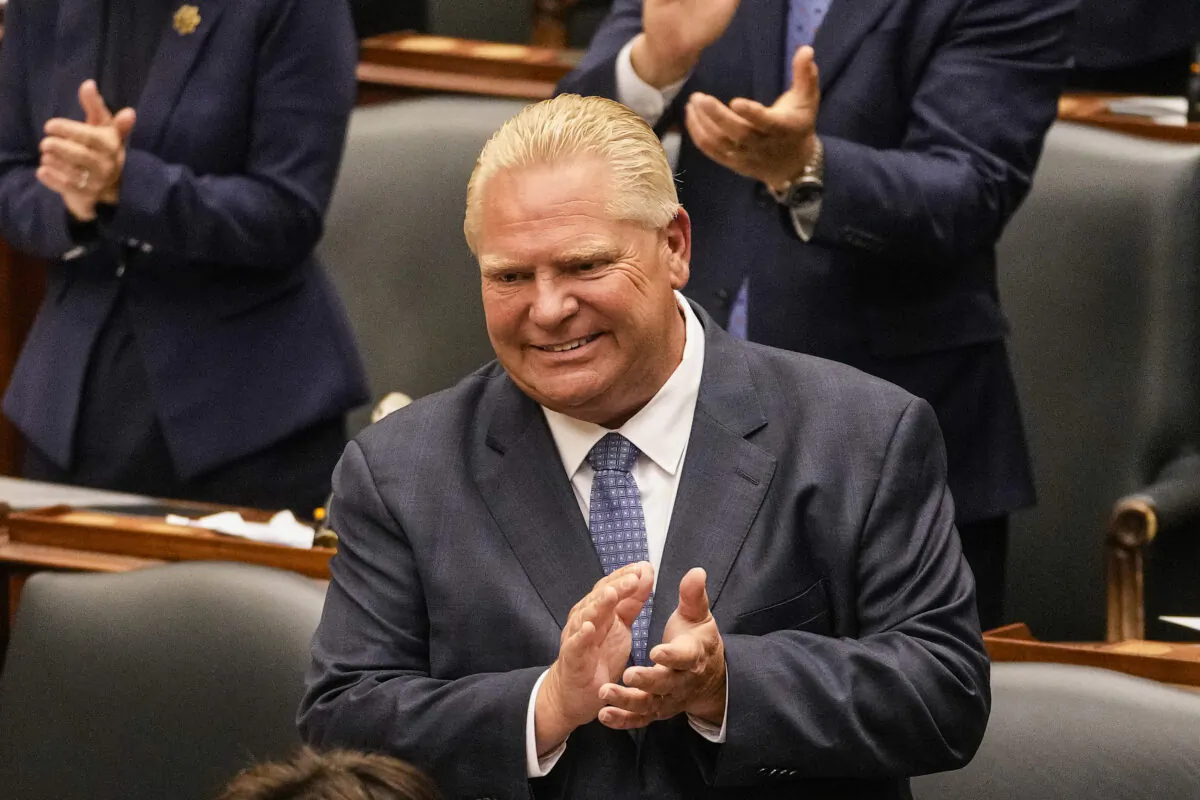 Ontario Premier Doug Ford applauds as Lt.-Gov. Elizabeth Dowdeswell delivers her Speech from the Throne at Queen's Park in Toronto on Aug. 9, 2022. (THE CANADIAN PRESS/Andrew Lahodynskyj)