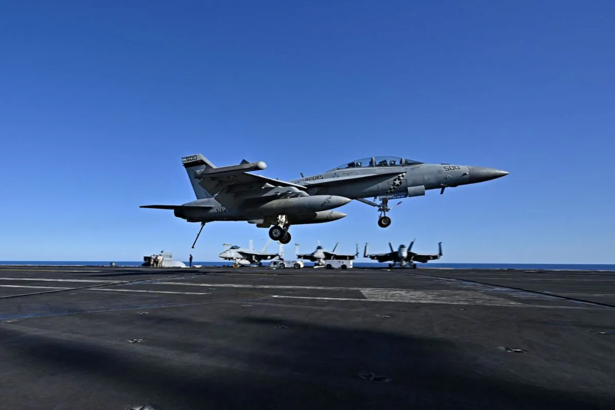 An F/A-18 Hornet fighter jet landing on the deck of the US Nimitz-class nuclear-powered aircraft carrier USS Harry S. Truman, during a NATO vigilance activity NEPTUNE SHIELD 2022 (NESH22) on eastern Mediterranean Sea, on May 23, 2022. (Andreas Solaro/AFP via Getty Images)