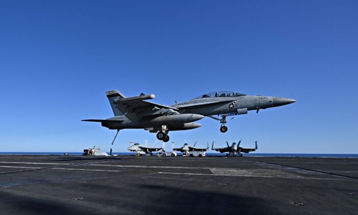 An F/A-18 Hornet fighter jet landing on the deck of the U.S. Nimitz-class nuclear-powered aircraft carrier USS Harry S. Truman, during a NATO vigilance activity NEPTUNE SHIELD 2022 (NESH22) on eastern Mediterranean Sea, on May 23, 2022. (Andreas Solaro/AFP via Getty Images)