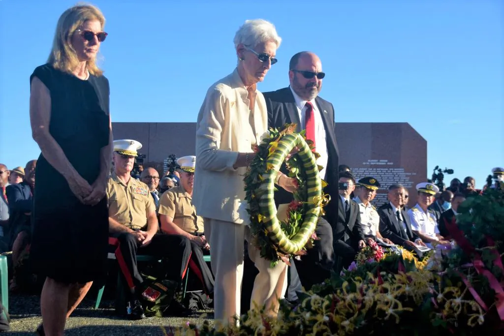 US Deputy Secretary of State Wendy Sherman (C) lays a wreath next to US Ambassador to Australia Caroline Kennedy (L) during a ceremony marking the 80th anniversary of the Battle of Guadalcanal at Skyline Ridge in Honiara on the Solomon Islands on Aug. 7, 2022. (Charley Piringi/AFP via Getty Images)