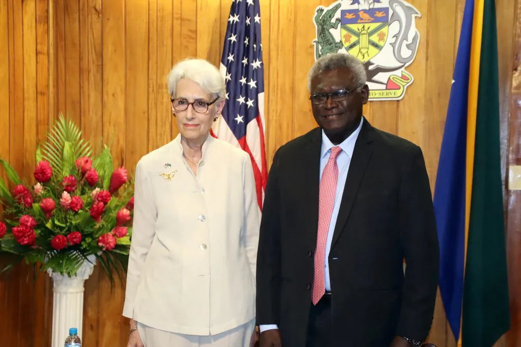 U.S. Deputy Secretary of State Wendy Sherman posing for pictures with the Solomon Islands Prime Minister Manasseh Sogavare after a ceremony to mark the 80th anniversary of the Battle of Guadalcanal at Skyline Ridge in Honiara, Solomon Islands, on Aug. 7, 2022. (Mavis Podokolo/AFP via Getty Images)