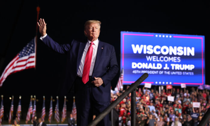 Former President Donald Trump greets supporters during a rally in Waukesha, Wisconsin on August 5, 2022. (Scott Olson/Getty Images)