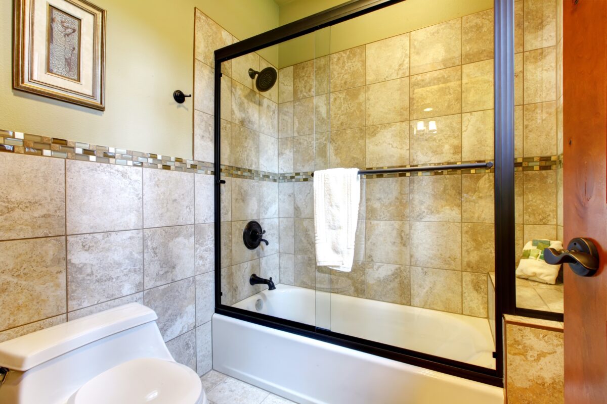 Replace a shower curtain with a sliding tub door. (Dreamstime/TNS)