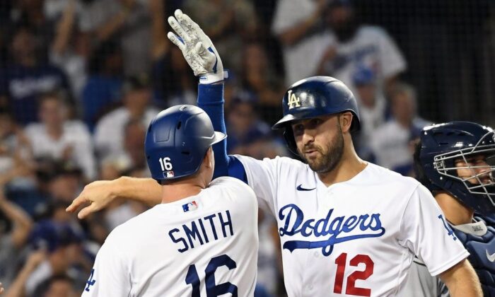 Los Angeles Dodgers right fielder Joey Gallo (12) celebrates with catcher Will Smith (16) after hitting a three run home run in the seventh inning against the Minnesota Twins at Dodger Stadium in Los Angeles, Aug. 10, 2022. (Richard Mackson/USA TODAY Sports via Field Level Media)