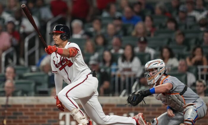 Atlanta Braves second baseman Vaughn Grissom (18) hits an infield single against the New York Mets during the seventh inning at Truist Park in Atlanta. (Dale Zanine-USA TODAY Sports via Field Level Media)