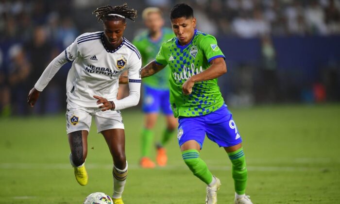 Los Angeles Galaxy forward Kevin Cabral (9) plays for the ball against Seattle Sounders forward Raul Ruidiaz (9) during the first half at Dignity Health Sports Park in Carson, Calif., Aug. 19, 2022. (Gary A. Vasquez/USA TODAY Sports via Field Level Media)
