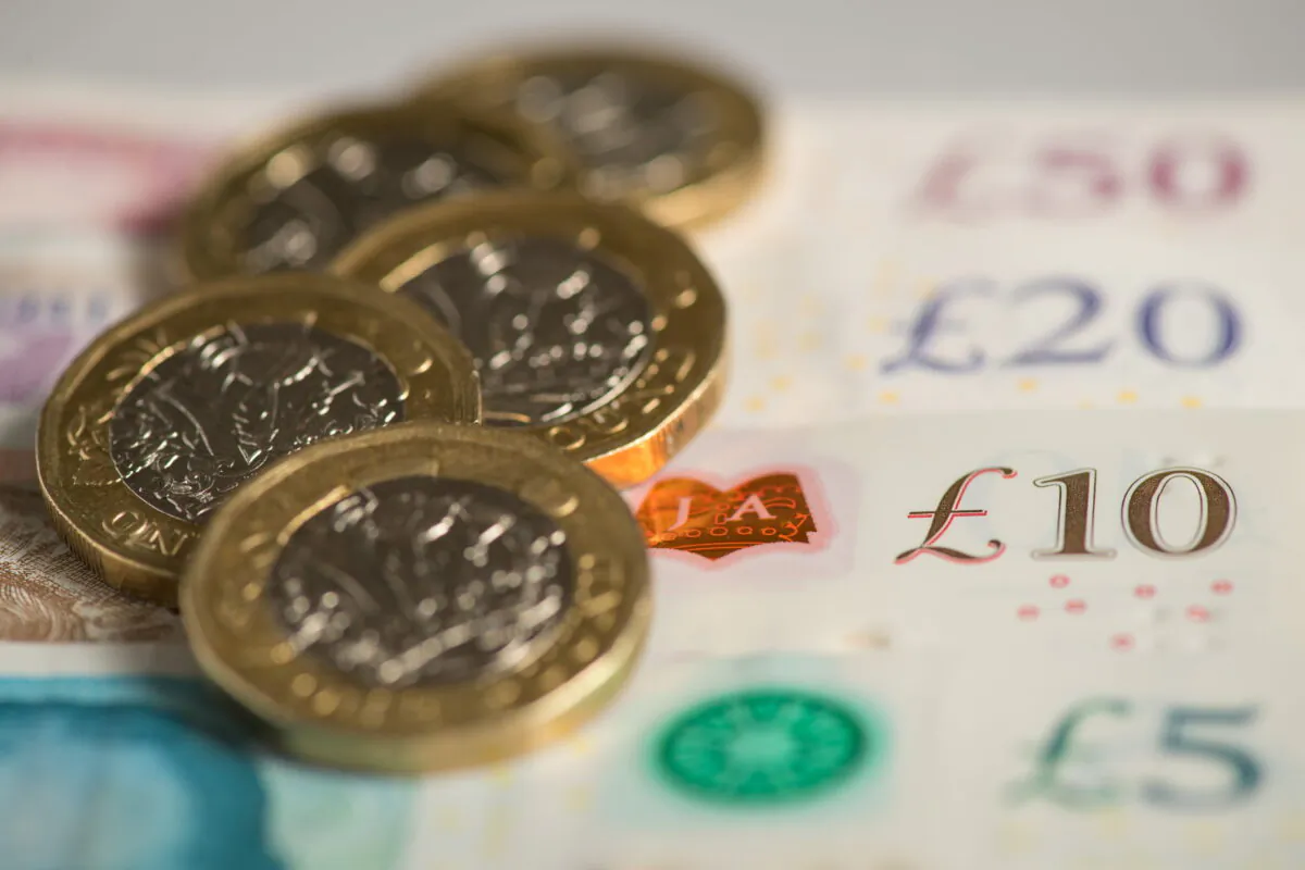 A selection of UK bank notes and pound coins, in an undated file photo. (Dominic Lipinski/PA)