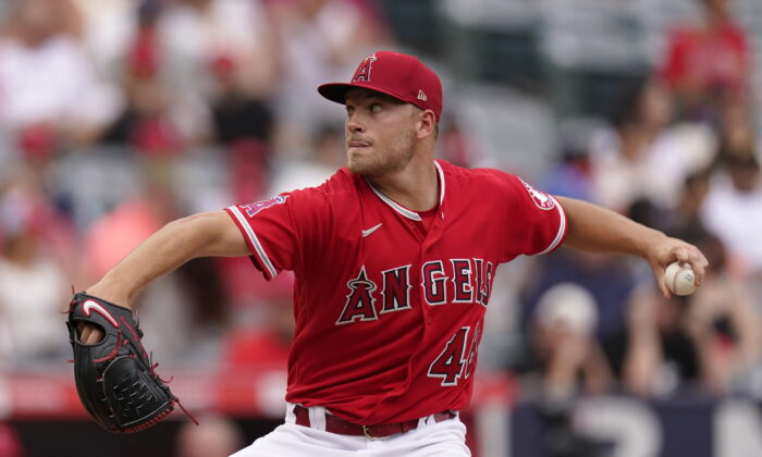 Los Angeles Angels starting pitcher Reid Detmers throws to the plate during the second inning of a baseball game against the Texas Rangers in Anaheim, Calif., Sunday, July 31, 2022. (AP Photo/Mark J. Terrill)