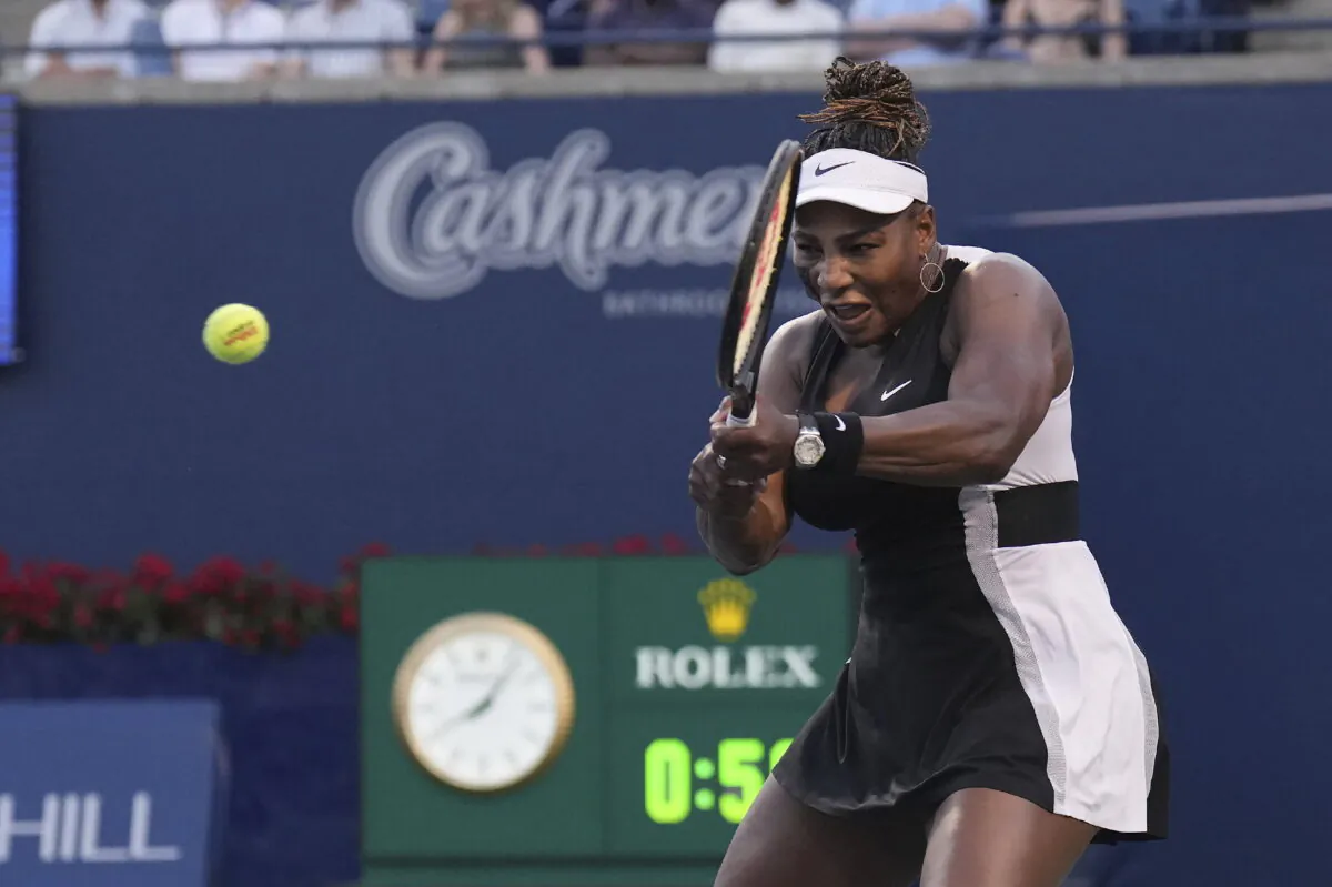 Serena Williams, of the United States, hits a backhand to Belinda Bencic, of Switzerland, during the National Bank Open tennis tournament in Toronto on Aug. 10, 2022. (Nathan Denette/The Canadian Press via AP)