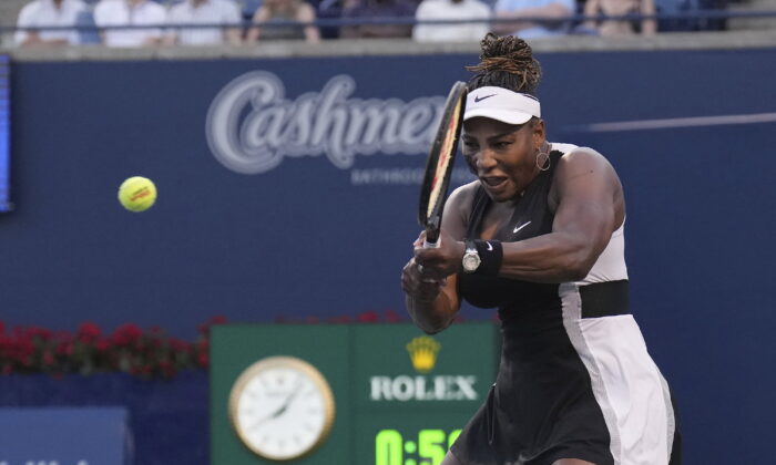 Serena Williams, of the United States, hits a backhand to Belinda Bencic, of Switzerland, during the National Bank Open tennis tournament in Toronto on Aug. 10, 2022. (Nathan Denette/The Canadian Press via AP)