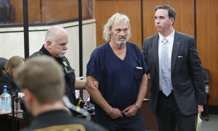Curtis Edward Smith is escorted out of Richland County Bond court with his attorney, Jarrett Bouchette, in Columbia, S.C., on June, 28, 2022. (Tracy Glantz/The State via AP)