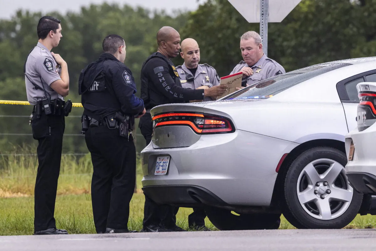 Wake County Sheriff deputies work at the scene where a deputy was shot and killed in eastern Wake County, N.C., on Aug. 12, 2022. (Travis Long/The News & Observer via AP)