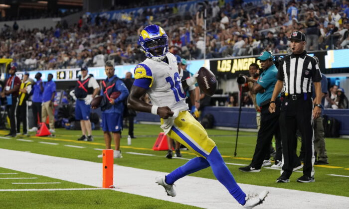 Los Angeles Rams quarterback Bryce Perkins (16) scores a touchdown during the second half of the team's preseason NFL football game against the Los Angeles Chargers in Inglewood, Calif., on Aug. 13, 2022. (Mark J. Terrill/AP Photo)