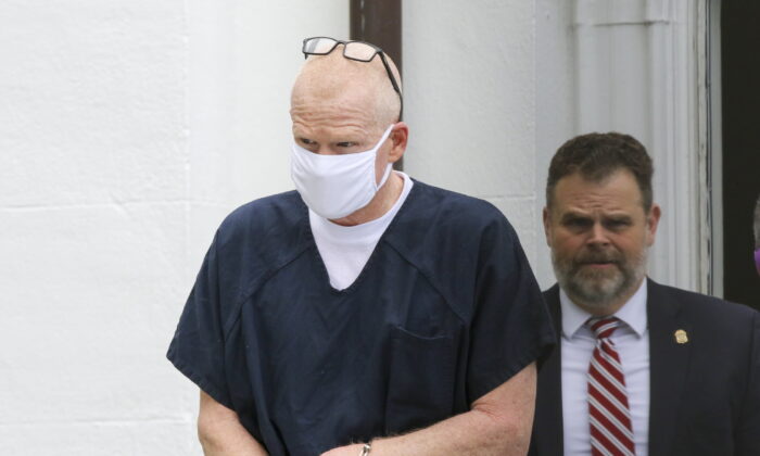 Alex Murdaugh is escorted out of the Colleton County Courthouse in Walterboro, S.C., on July 20, 2022. (Tracy Glantz/The State via AP)
