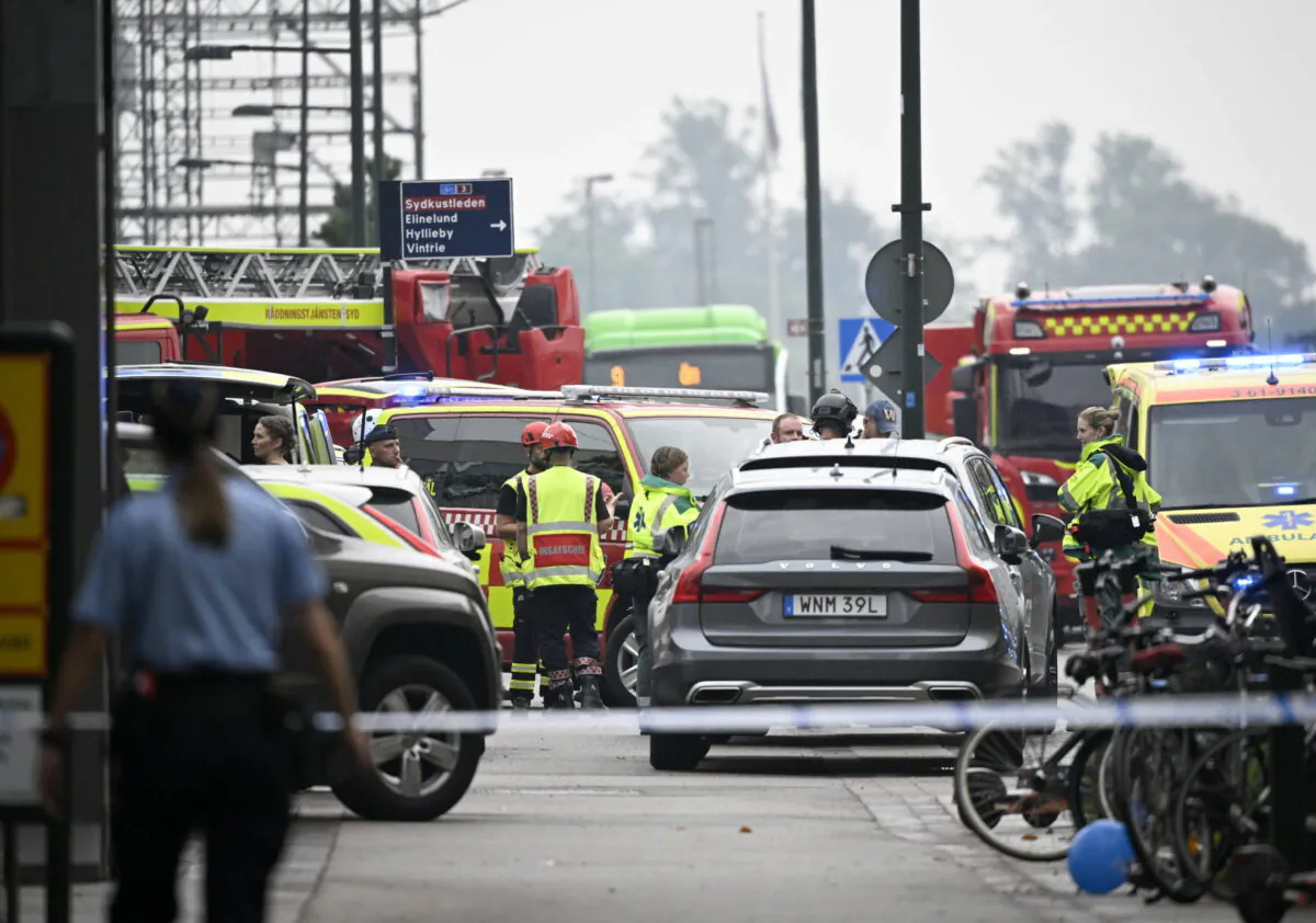 Police officers cordon off the area of a shooting outside the Emporia shopping center in Malmo, Sweden, on Aug. 19, 2022. (Johan Nilsson/TT News Agency via AP)