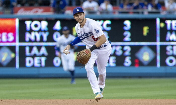 Los Angeles Dodgers shortstop Trea Turner prepares to throw out Miami Marlins' Jesus Aguilar during the first inning of a baseball game in Los Angeles, Aug. 19, 2022. (Alex Gallardo/AP Photo)