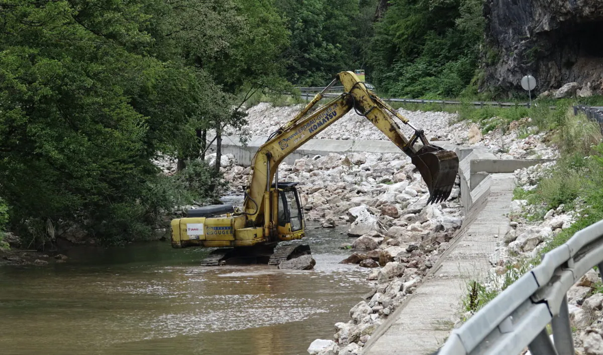 A caterpillar is seen by a small hydro power plant on the Zeljeznica river near the town of Trnovo, on July 9, 2022. (Eldar Emric/AP Photo)