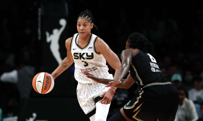 Chicago Sky forward Candace Parker (3) drives to the basket against New York Liberty forward Natasha Howard (6) during the first half of a WNBA basketball playoff game in New York on Aug. 23, 2022. (Noah K. Murray/AP Photo)