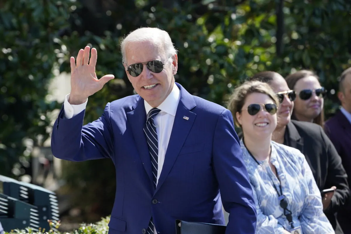 President Joe Biden waves after returning to the White House in Washington, on Aug. 24, 2022. Biden and his family spent time in Delaware for summer vacation. (AP Photo/Susan Walsh)