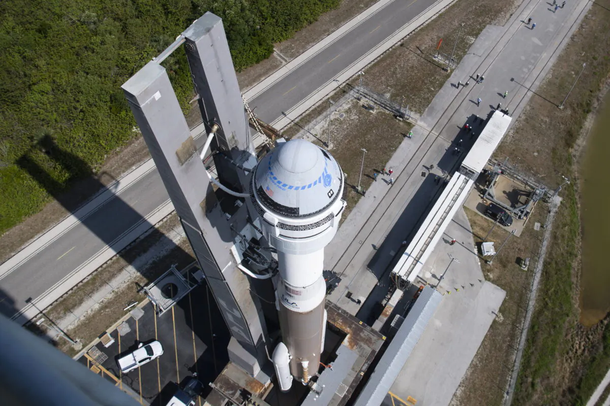 A United Launch Alliance Atlas V rocket with Boeing's CST-100 Starliner spacecraft is rolled out of the Vertical Integration Facility to the launch pad at Space Launch Complex 41 ahead of the Orbital Flight Test-2 (OFT-2) mission at Cape Canaveral Space Force Station in Florida, on May 18, 2022. (Joel Kowsky/NASA via AP)