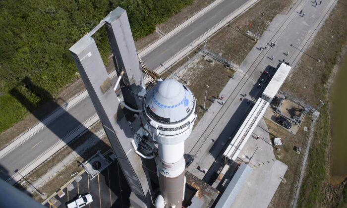A United Launch Alliance Atlas V rocket with Boeing's CST-100 Starliner spacecraft is rolled out of the Vertical Integration Facility to the launch pad at Space Launch Complex 41 ahead of the Orbital Flight Test-2 (OFT-2) mission at Cape Canaveral Space Force Station in Florida, on May 18, 2022. (Joel Kowsky/NASA via AP)