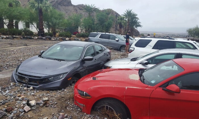 Cars are stuck in mud and debris from flash flooding at The Inn at Death Valley in Death Valley National Park, Calif., on Aug. 5, 2022. (National Park Service via AP)