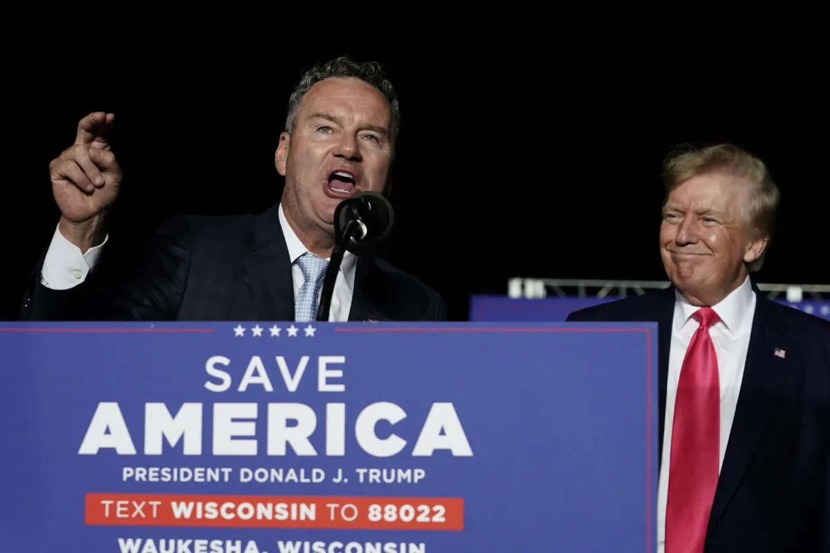 Wisconsin Republican gubernatorial candidate Tim Michels (L), speaks as former President Donald Trump listens at a rally in Waukesha, Wis., on Aug. 5, 2022. (Morry Gash/AP Photo)