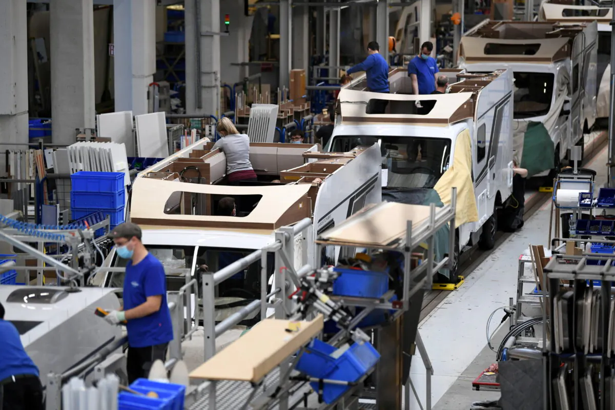 Workers assemble campers at Knaus-Tabbert AG factory in Jandelsbrunn near Passau, Germany, on March 16, 2021. (Andreas Gebert/Reuters)
