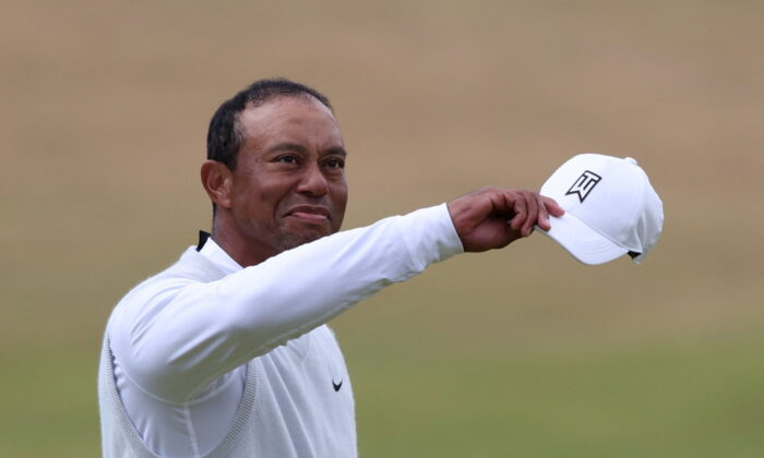 Tiger Woods of the U.S. acknowledges spectators after finishing his second round at the 150th Open Championship, Old Course, St Andrews, Scotland, Britain, on July 15, 2022. (Russell Cheyne/Reuters)