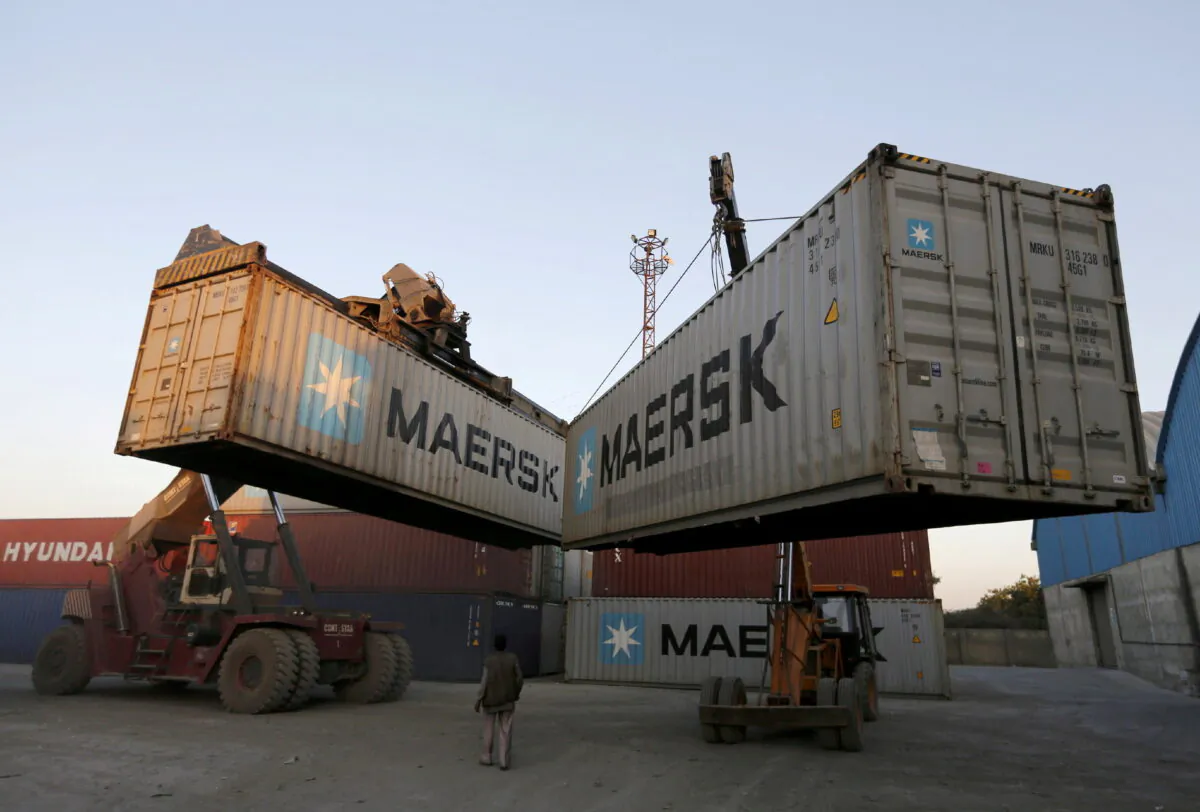Mobile cranes prepare to stack containers at Thar Dry Port in Sanand in the western state of Gujarat, India, on Feb. 10, 2016. (Amit Dave/Reuters)