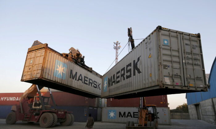 Mobile cranes prepare to stack containers at Thar Dry Port in Sanand in the western state of Gujarat, India, on Feb. 10, 2016. (Amit Dave/Reuters)