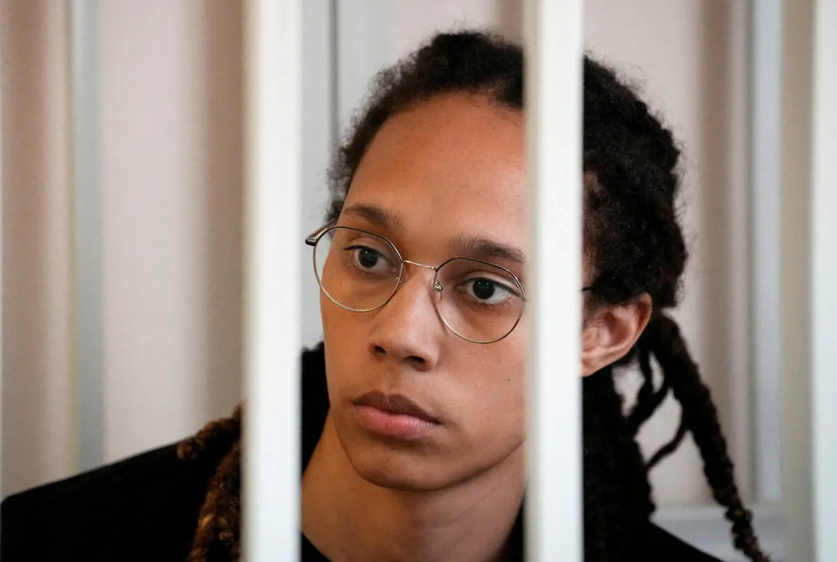 WNBA star and two-time Olympic gold medalist Brittney Griner sits in a cage at a court room prior to a hearing in Khimki, outside Moscow on July 27, 2022. (Alexander Zemlianichenko/Pool via Reuters)